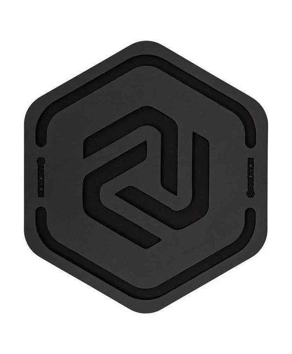 Black hexagonal silicone hookah coaster with modern geometric design, top view