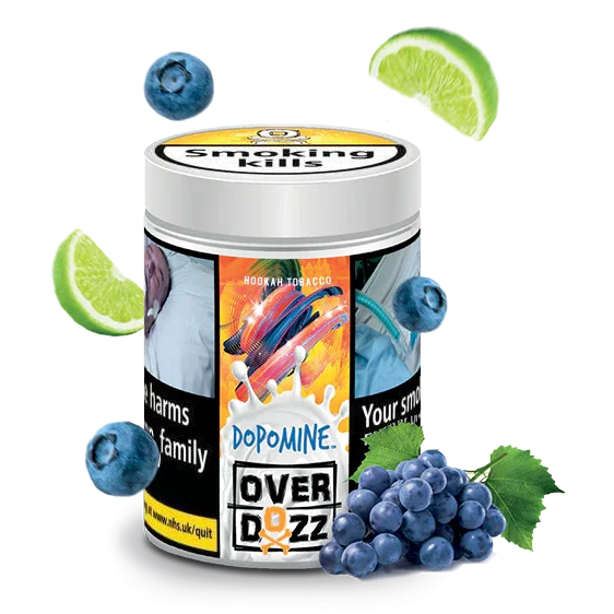 Hookah tobacco tin with Dopomine Overdozz label, surrounded by blueberries, grapes, and lime slices