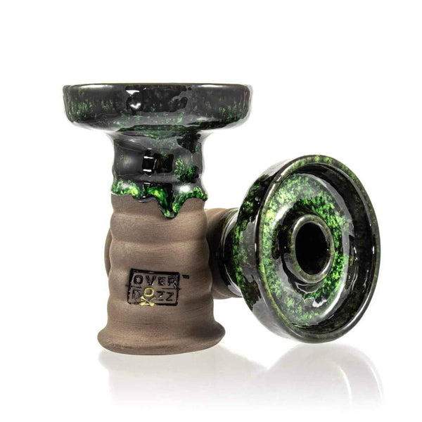 Ceramic hookah bowl with green and black glazed top, ribbed clay base, side view